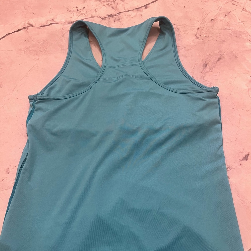 Lucky In Love Aqua sleeveless tennis top with built in shelf. Size Medium.